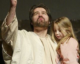 William D. Lewis|The Vindicator Jesus, portrayed by Bob Little of McDonald holds Kiersten Laing during Passion Play at Highway Tabernacle in Austintown.