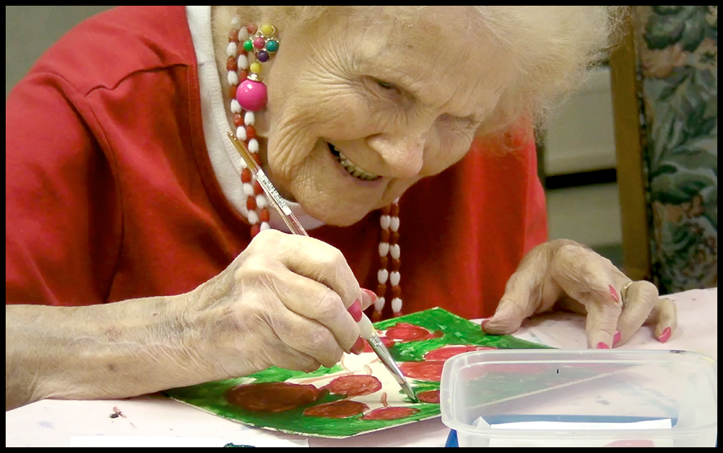 ROBERT K. YOSAY | THE VINDICATOR...Ruth Cooper works on a flower - Residents of Ashley Circle at Briarfield in Austintown paint with instruction from Suzanne Gray. Now they have a little gallery, called PicassoÕs Corner, at the facility, to display their work.-30-