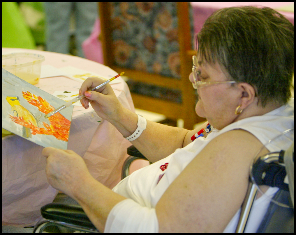 ROBERT K. YOSAY | THE VINDICATOR...Putting the finishing touches on her painting  Cynthia Bondar  finishes a bird -  Residents of Ashley Circle at Briarfield in Austintown paint with instruction from Suzanne Gray. Now they have a little gallery, called PicassoÕs Corner, at the facility, to display their work.-30-.
