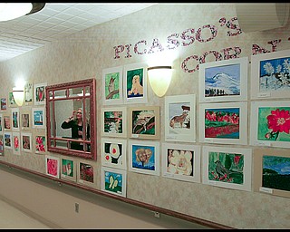 ROBERT K. YOSAY | THE VINDICATOR...The Picasso Corner as resident artists display their work with instructor Suzanne Gray - Residents of Ashley Circle at Briarfield in Austintown paint with instruction from Suzanne Gray. Now they have a little gallery, called PicassoÕs Corner, at the facility, to display their work.-30-.