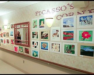 ROBERT K. YOSAY | THE VINDICATOR...The Picasso Corner as resident artists display their work with instructor Suzanne Gray - Residents of Ashley Circle at Briarfield in Austintown paint with instruction from Suzanne Gray. Now they have a little gallery, called PicassoÕs Corner, at the facility, to display their work.-30-.