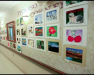 ROBERT K. YOSAY | THE VINDICATOR...The Picasso Corner as resident artists display their work with instructor Suzanne Gray - Residents of Ashley Circle at Briarfield in Austintown paint with instruction from Suzanne Gray. Now they have a little gallery, called PicassoÕs Corner, at the facility, to display their work.-30-.