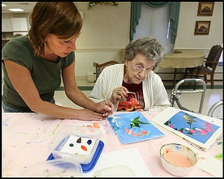 ROBERT K. YOSAY | THE VINDICATOR... Residents of Ashley Circle at Briarfield in Austintown paint with instruction from Suzanne Gray. Now they have a little gallery, called PicassoÕs Corner, at the facility, to display their work.-30-.
