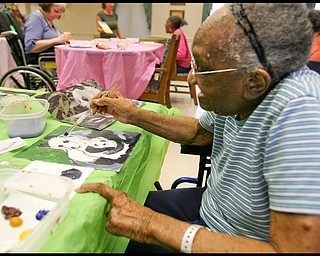 ROBERT K. YOSAY | THE VINDICATOR... Helen Bailey works on her pandas - Residents of Ashley Circle at Briarfield in Austintown paint with instruction from Suzanne Gray. Now they have a little gallery, called PicassoÕs Corner, at the facility, to display their work.-30-.