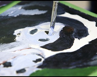 ROBERT K. YOSAY | THE VINDICATOR... Helen Bailey works on her pandas - Residents of Ashley Circle at Briarfield in Austintown paint with instruction from Suzanne Gray. Now they have a little gallery, called PicassoÕs Corner, at the facility, to display their work.-30-.
