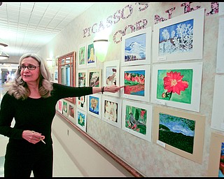 ROBERT K. YOSAY | THE VINDICATOR...The Picasso Corner as resident artists display their work with instructor Suzanne Gray - Residents of Ashley Circle at Briarfield in Austintown paint with instruction from Suzanne Gray. Now they have a little gallery, called PicassoÕs Corner, at the facility, to display their work.-30-.