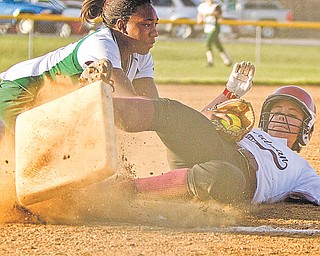 Ursuline’s Brianna Curd (1) successfully tags out Boardman’s Angela Martin (9) on her way to third base during the sixth inning of a game Thursday at Candlelight Knolls in Bazetta. The Spartans went on to defeat the Irish, 3-0, behind sophomore pitcher Nicola Gabriele, below.