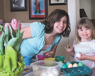 Malina Seil and her big sister, Alyssa Vivacqua, enjoy coloring Easter eggs. Parents are Dave and Joanne Seil and Mark Vivacqua, all of Boardman..