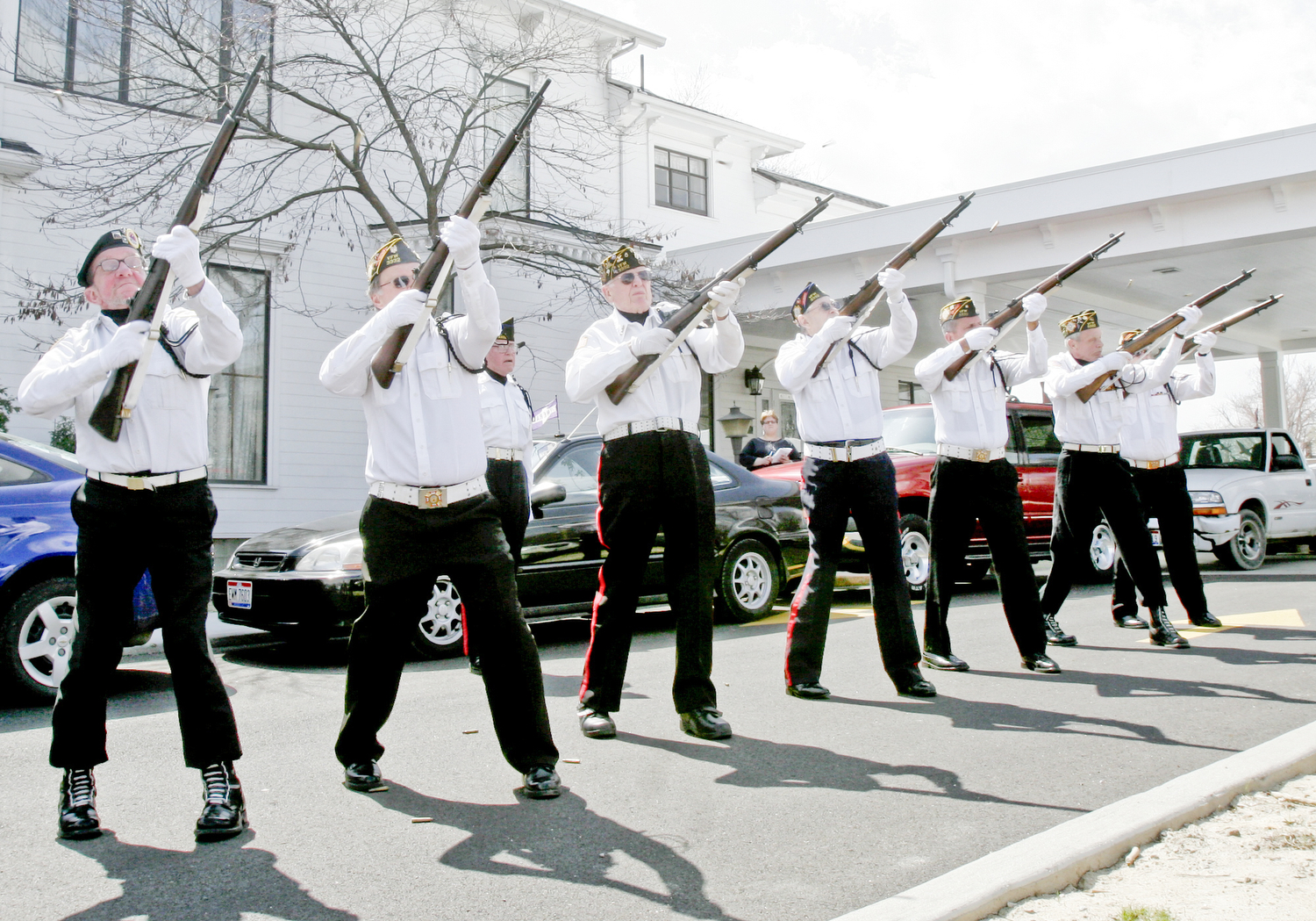 William D. Lewis | The Vindicator Members of Newton Falls Veterans Honor Guard fire a 21 gun salute during funeral service for Joshua Sherbourne, one of 3 Marine recruits, killed in a traffic accident. Services were held at Carl W. Hall Funeral Home in Warren Monday..