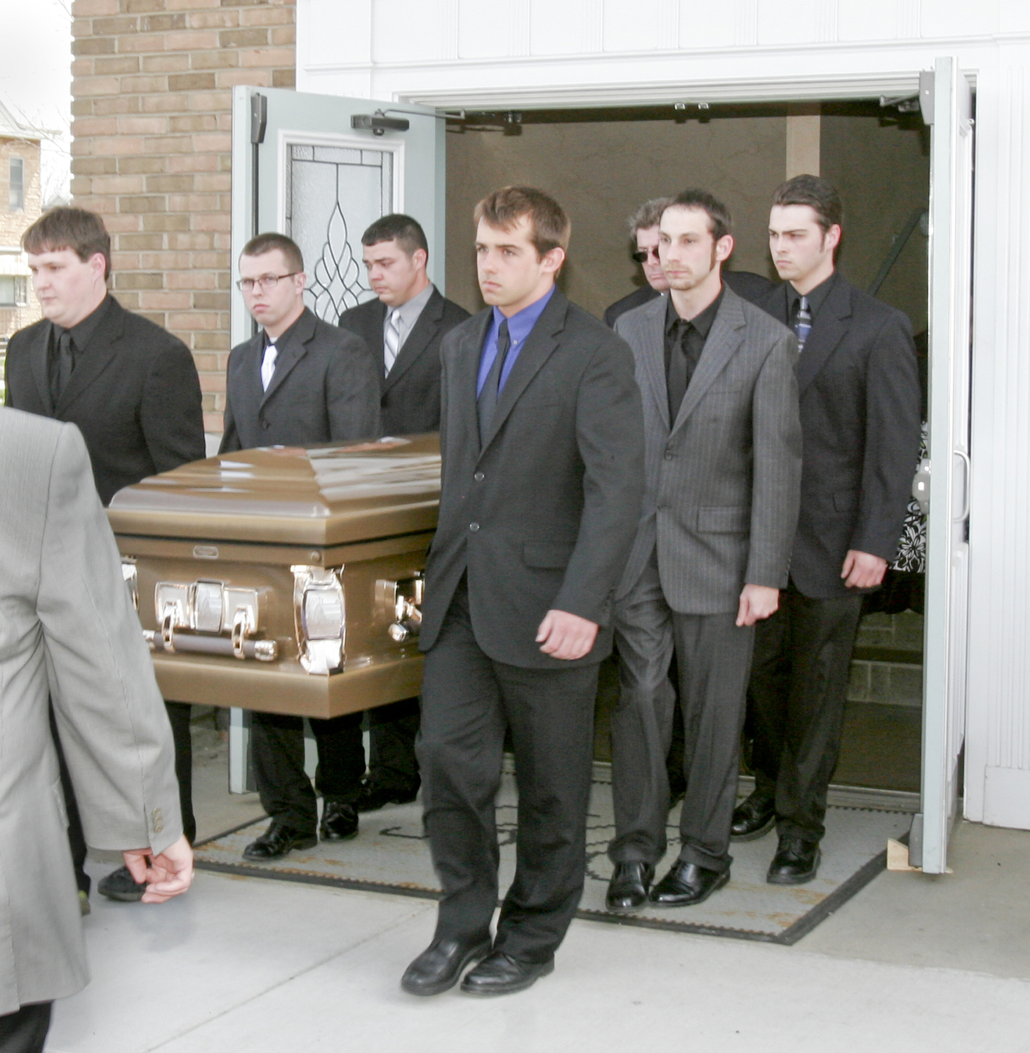 William D. Lewis | The Vindicator  Pallbearers carry the casket o during funeral service for Joshua Sherbourne, one of 3 Marine recruits, killed in a traffic accident. Services were held at Carl W. Hall Funeral Home in Warren Monday..