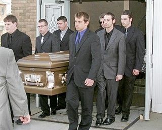 William D. Lewis | The Vindicator Pallbearers carry the casket o during funeral service for Joshua Sherbourne, one of 3 Marine recruits, killed in a traffic accident. Services were held at Carl W. Hall Funeral Home in Warren Monday..