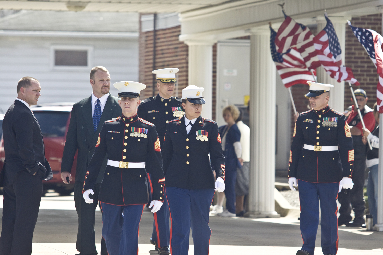 LISA-ANN ISHIHARA | THE VINDICATOR -- Marines leave James Funeral Home at 8  East Broad St in Newton Falls after paying at the calling hours for Zachary A. Nolen, one of three victims in fatal accident last week.