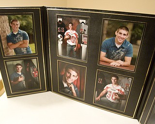 LISA-ANN ISHIHARA | THE VINDICATOR -- Photos of Michael Theodore are displayed at his calling hours at Peter Rossi & Son , one of three victims in fatal accident last week.