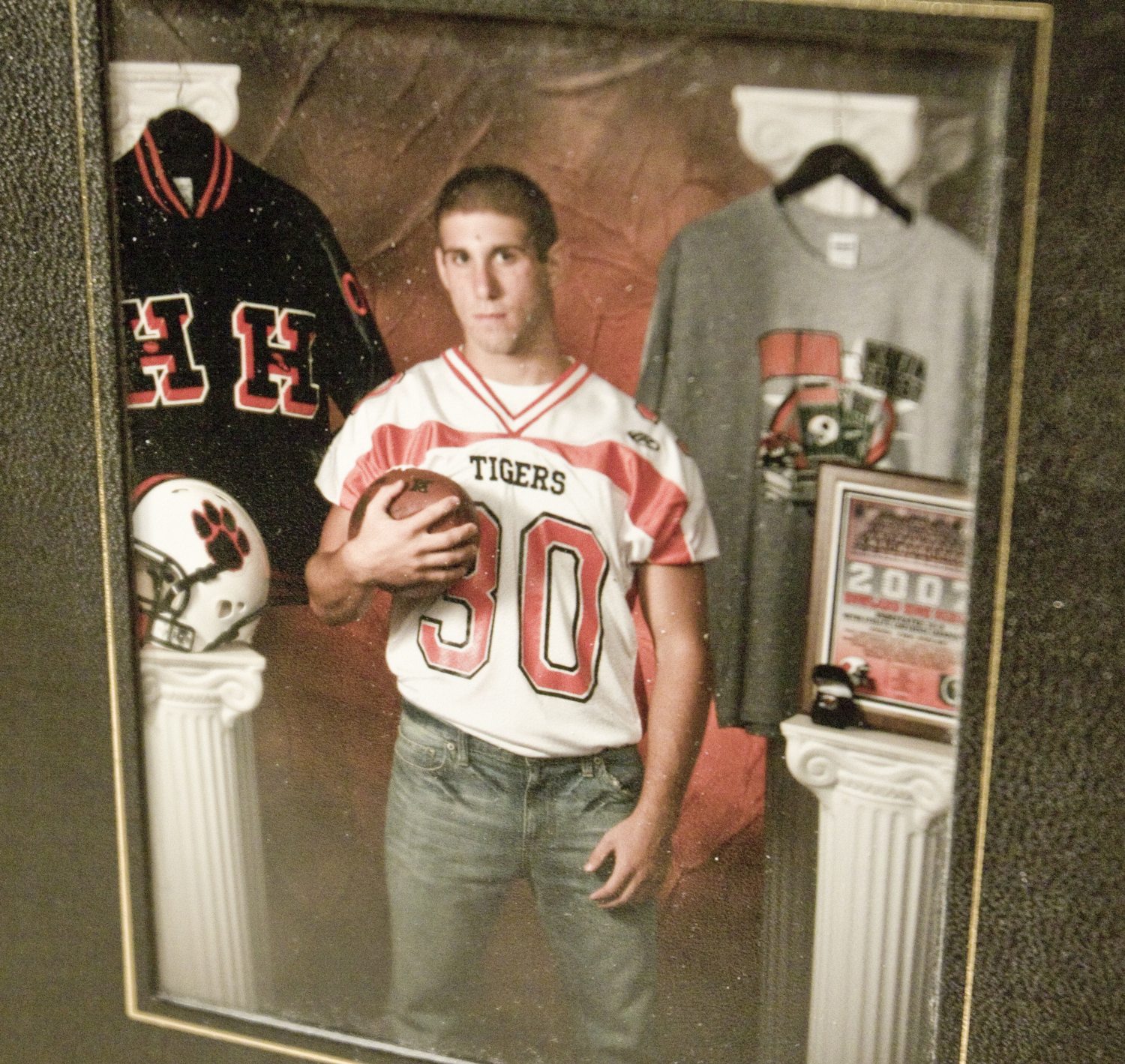 LISA-ANN ISHIHARA | THE VINDICATOR -- Photos of Michael Theodore are displayed at his calling hours at Peter Rossi & Son , one of three victims in fatal accident last week.