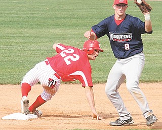 Youngstown State’s Tom Clayton (22) and Andrew Heck (8) of Duquesne wait for the official ruling on a close play at second base during Wednesday’s game at Eastwood Field in Niles. Clayton was safe, and the Penguins went on to win 22-8.
