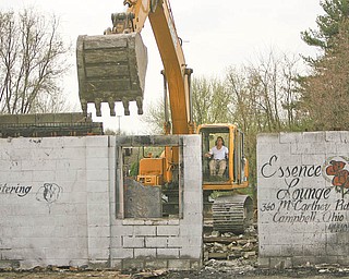Cosmo Iamurri, owner of Pro Quality Land Development in Campbell, tears down the Essence Lounge on U.S. Route 422. Iamurri did the razing in return for some city land near his business.