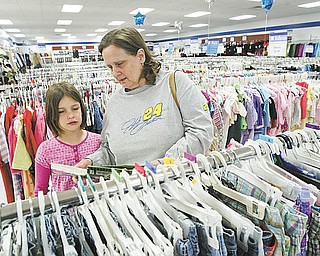 Dianna Bondi and her 8-year-old granddaughter, Lezlee Bondi, visit the Austintown Goodwill Store during its grand opening. About 150 people lined up Thursday morning outside the store in the Austintown Plaza on Mahoning Avenue to be the first ones inside when doors opened at 9 a.m.
