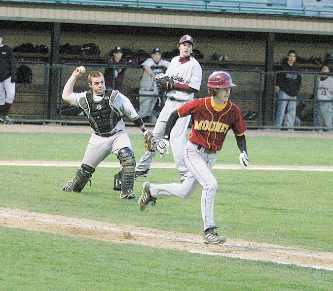 Boardman catcher Dan Popio, left, throws out Dan Reese of Cardinal Mooney at first base during Monday’s game at Cene Park.