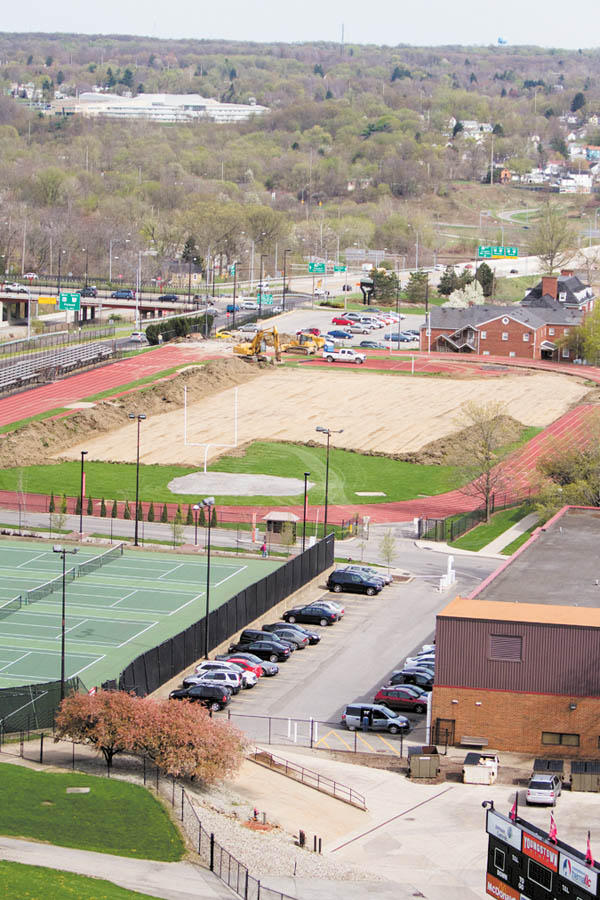 Youngstown State University began preparing for the WATTS Center, background, on Monday. The university hopes to have the facility completed by the end of this year.