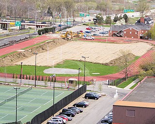 Youngstown State University began preparing for the WATTS Center, background, on Monday. The university hopes to have the facility completed by the end of this year.