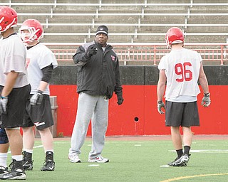 Youngstown State assistant football coach Ron Stoops said the transition to coaching college players after so many years in high school is getting easier every day.