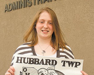 Tori Sylvester, a sophomore at Hubbard High School, shows off her winning entry in a flag-design contest sponsored by Hubbard Township. She was recognized at a trustees meeting this week. Tori used an eagle prominently in the design because it’s the mascot of the school’s athletic teams.