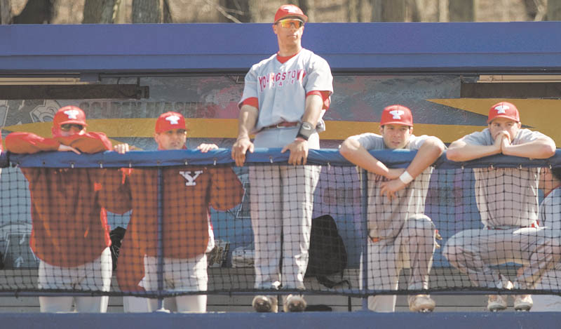 Geoffrey Hauschild|The Vindicator.YSU's Jeremy Banks (3) stands center among teamates during the third inning of a game at Kent State's Schoonover Stadium on Wednesday afternoon.