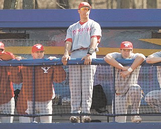 Geoffrey Hauschild|The Vindicator.YSU's Jeremy Banks (3) stands center among teamates during the third inning of a game at Kent State's Schoonover Stadium on Wednesday afternoon.