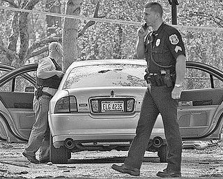 Boardman police and U.S. marshals respond to a Wednesday afternoon shooting on Mill Creek Boulevard. The victim suffered multiple gunshots, but the man was still talking when he was taken to St. Elizabeth Health Center. Police were doing a house-to-house canvass as their investigation got under way.