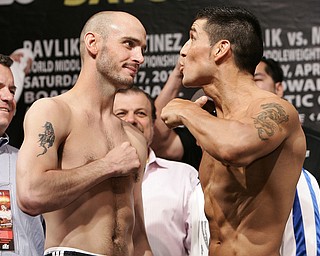 4/16/10,Atlantic City,N.J.   --- (L-R)  World Middleweight Champion Kelly Pavlik, Youngstown,Ohio and WBC Super Welterweight Champion Sergio Martinez of Spain pose during the weighin Friday for their upcoming World Middleweight Championship at the historic Boardwalk Hall in Atlantic City,NJ on Saturday, April 17. Top Rank is promoting in association with DiBella Entertainment and Caesars Atlantic City. Pavlik vs Martinez will be televised on HBO World Championship Boxing.  --- Photo Credit : Chris Farina - Top Rank  (no other credit allowed)  copyright 2010