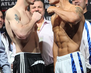 Kelly Pavlik of Youngstown, Ohio, left, and Sergio Martinez, of Argentina, face off after their weigh-in for a WBC middleweight championship fight, Friday, April 16, 2010,  in Atlantic City, N.J.  (AP Photo/Sean M. Fitzgerald)