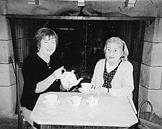 Marge Gollner, left, and Rae Jeanne Mollica are serving as co-chairwomen of the Austintown Historical Society’s 17th annual High Tea that will take place Sunday at the Strock Stone House.