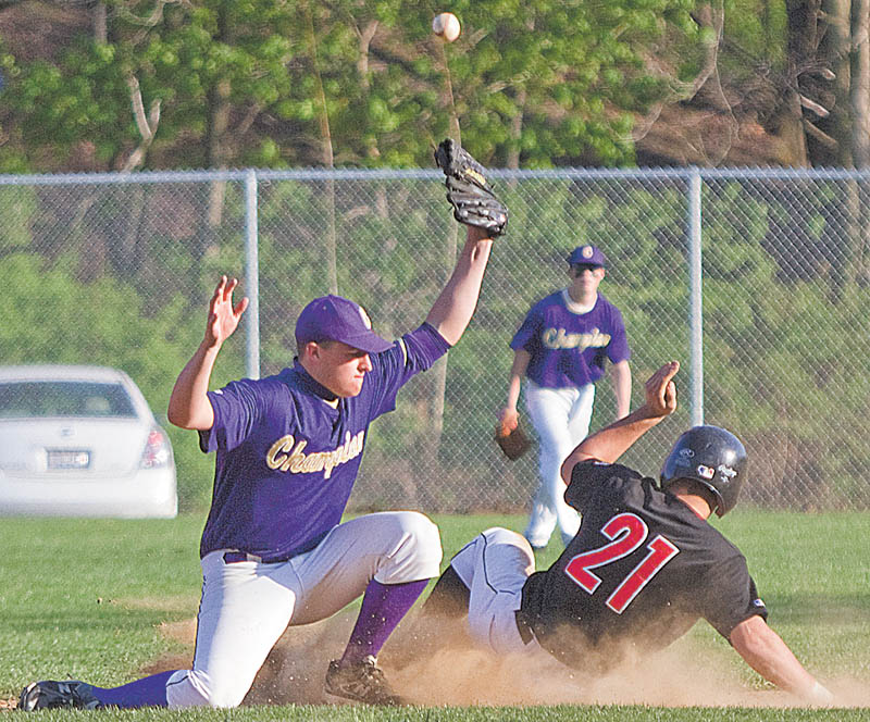 Champion’s Billy Wartz (12) bobbles the ball, allowing Girard’s Michael Floravit (21) to slide safely into second base in the bottom of the sixth during Wednesday’s game in Girard. The game was tied 4-4 until the bottom of the fifth when a single by Aaron Jennigs put the Indians ahead 6-4. They went on to win 7-4.