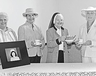 Nick Mays | The Vindicator: Sampling tea to be served by the Ladies of Charity at the annual Tea For Green on May 2 are , from left, Betty Conway, President; Dee Balogh, co-chairwoman; Sister Lois Walter, and Jacqueline Price, chairwoman. 