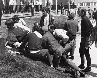 A Kent State University student lies on the ground after National Guardsman fired into a crowd of demonstrators on May 4, 1970 in Kent, Ohio. (AP Photo)