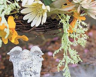 A wreath and an angel statue comprise a makeshift memorial where a car slammed into a Campbell home early Saturday, killing three of the car’s four occupants. None of the identities has been released, but family members say one of the dead is Ian Stores, 17, of Campbell. 
