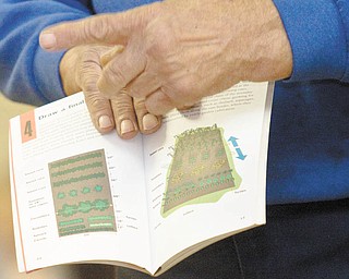 Harding shows examples from a book of what not to do when it comes to gardening.