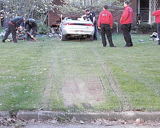 Three were killed Saturday when a car traveling between 80 and 90 mph on Blossom Avenue crashed into a house, top, at 525 Cynthia Drive, where Blossom dead-ends.