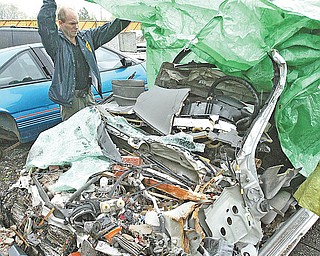 Three were killed Saturday when a car traveling between 80 and 90 mph on Blossom Avenue crashed into a house, top, at 525 Cynthia Drive, where Blossom dead-ends. This is a picture of the car after the accident.