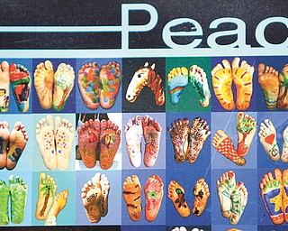 About 310 pairs of feet, painted with mostly peace themes, make up a montage created by Suzanne Bort Gray at the Davis Family YMCA in Boardman. The piece is being sent to Australia as part of the Global Art Project for Peace.