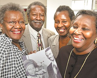 The children of the late Ruby and the Rev. Fred Shuttlesworth (in the photo) carry on the legacy of their father. From left, Ruby Shuttlesworth Bester, Fred Shuttlesworth Jr., Carolyn Shuttlesworth and Patricia Shuttlesworth Massengill .