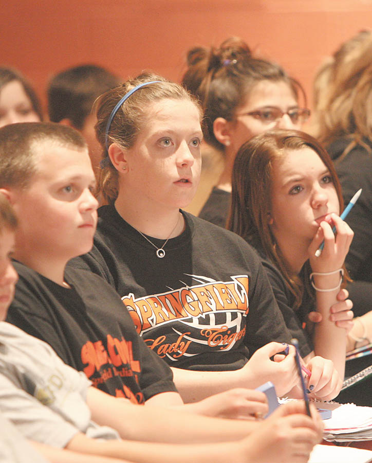 Springfi eld Intermediate seventh-graders, from left, Tyler Caradona, Rachel Crowe, Jocelyn Benzenhoefer and McKenzie Brown (partially hidden) listen intently as Mike Byster teaches them methods to improving their memory and academic performance. The students got the chance to put what they learned into practice as Byster put them to the test with some memory and math exercises.