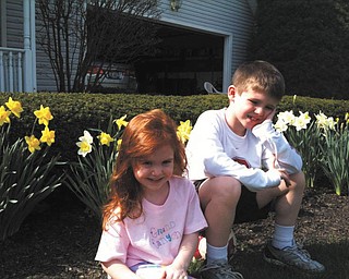 Aidan and Alyse Murphy, son and daughter of Theresa and Kevin Murphy, are enjoying a beautiful spring day in their front yard.