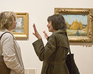 LISA-ANN ISHIHARA | THE VINDICATOR ..L-R Ginny Hazy of Hubbard and Hannah Moses of Hermitage, PA discuss the artwork of Amercan Impressionist Robert Vonnoh at The Butler Institute of American Art. The Butler owns "In Flanders Field" with the rest of the pieces being on loan, Sunday, May 2, 2010