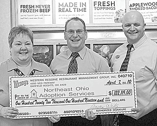 Western Reserve Restaurant Management Group, the owner/operator of 29 Wendy’s restaurants in Cuyahoga and Lorain counties, presented a check for $122,119 to Northeast Ohio Adoption Services on April 7, bringing their total contribution to $849.345 over the past 10 years. Shown during the presentation of a symbolic check are, from left, Cynthia Deal of NOAS; Randy Writz, area director of the management group, who made the presentation; and Jason Truxall, manager of the top selling St. Clair Wendy’s.