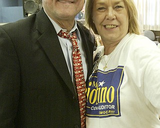 William D. Lewis| The Vindicator Bob Hagan talks with supporter Sandy Mitovich-Beam of Ytown during party in Mahoning Plaza Tuersday night.
