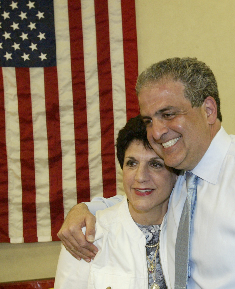 William D Lewis The Vindicator Carol Rimedio righetti embraces David Betras during party tuesday at Mahoning Plaza.