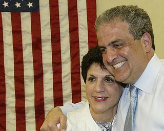 William D Lewis The Vindicator Carol Rimedio righetti embraces David Betras during party tuesday at Mahoning Plaza.