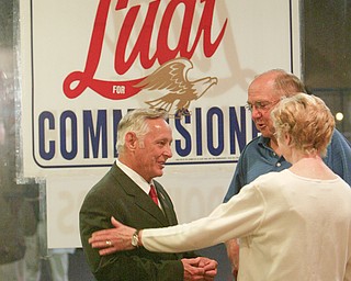 ROBERT K. YOSAY | THE VINDICATOR..Dave Ludt gets a handshake from George and Marian Kluchar of Boardman . at Ludts Campaign HQ in Boardman Plaza -30-