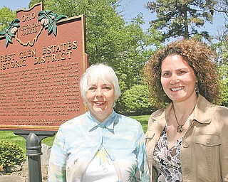 Lynn Kirkwood, left, and Susan Sweeney, vice president and president, respectively, of the Forest Glen Homeowners’ Association, stand next to the marker designating their neighborhood a historic district. Residents of both the Forest Glen and the Newport Glen historic areas expressed worries to Boardman trustees last week about increased crime. The township has a plan to address it and educate all residents about how to protect themselves.